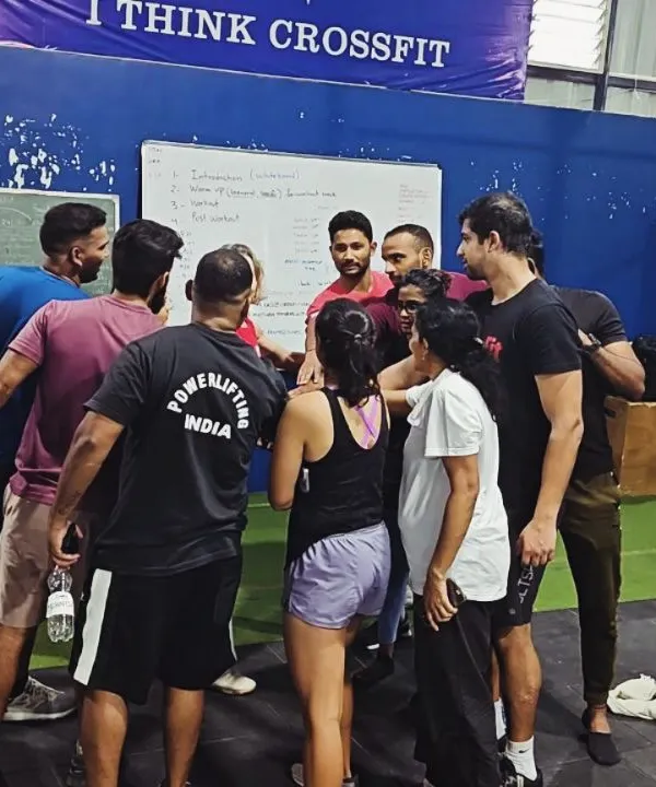 A team huddle during a CrossFit Level 2 certification seminar hosted at our facility. We love bringing the broader community together to learn and grow.