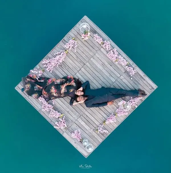 This is what I mean by capturing your love from a new perspective. A stunning aerial drone shot gives this quiet moment on the water a truly epic and cinematic feel, perfect for a save-the-date that will leave everyone speechless.
