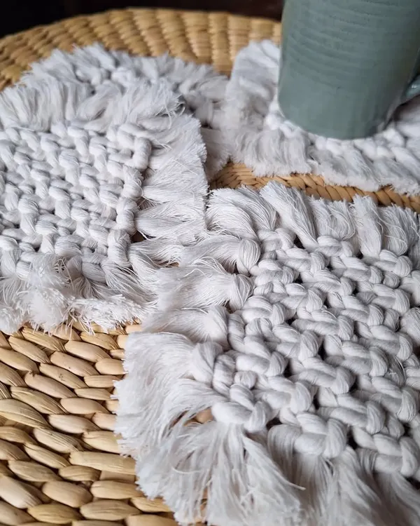 A set of my woven macrame coasters, perfect for a modern, minimalist look. They have a lovely texture and a simple fringe.