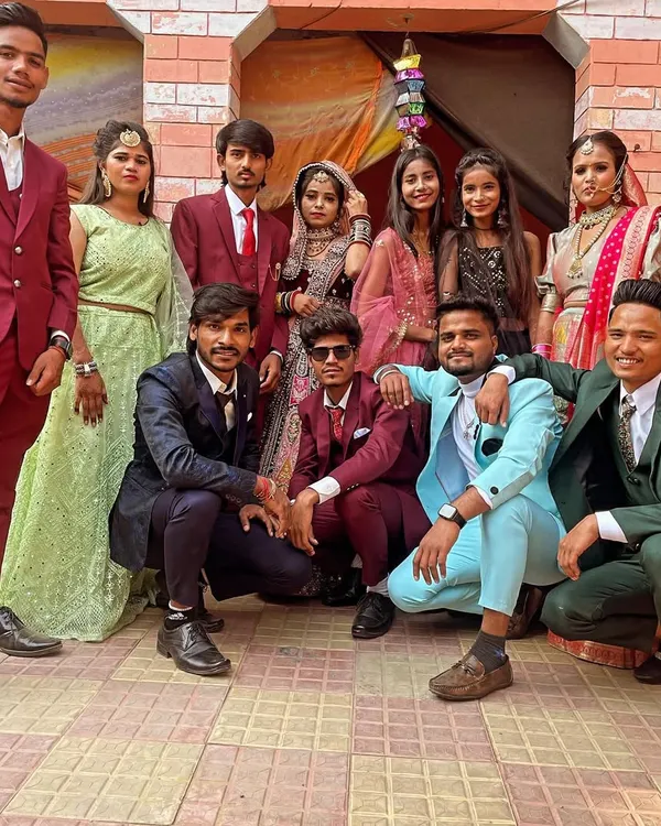 It’s always special to see the whole family come together for a wedding. Here I am with some of the family members and friends at a wedding event.