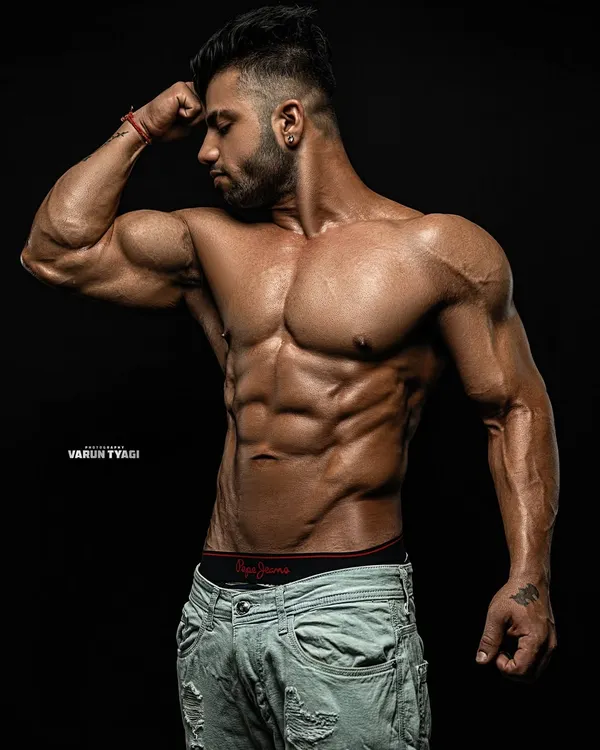 Fully loaded and in condition. This is a professional shot of my own physique, showcasing the level of definition I maintain.