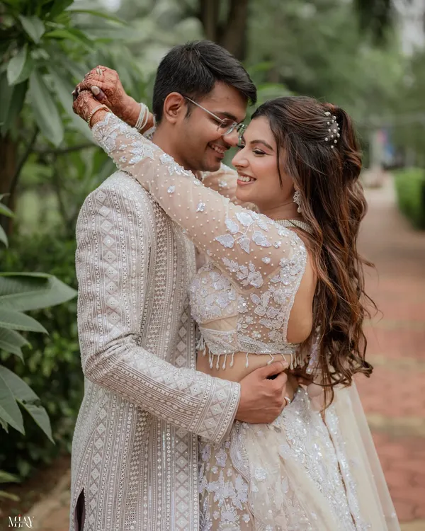 This is what pure happiness looks like. We specialize in creating a comfortable atmosphere where you can be yourselves, resulting in genuine, candid couple portraits like this intimate embrace, set against a lush, natural backdrop.