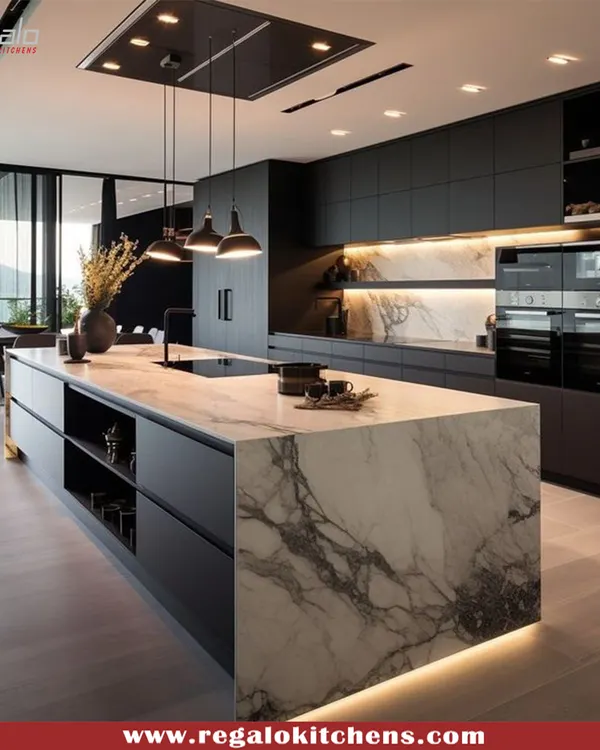 A masterclass in contrast and texture. This kitchen features a bold, black design with a striking marble waterfall island, creating a dramatic focal point. We integrated high-end appliances and minimalist cabinetry to maintain a sleek, uncluttered look perfect for modern luxury homes.
