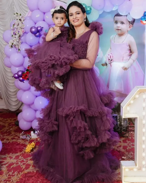 This mother-daughter combo in a beautiful mauve ruffle design is available to rent or buy. I can create custom new outfits from scratch for your special event.