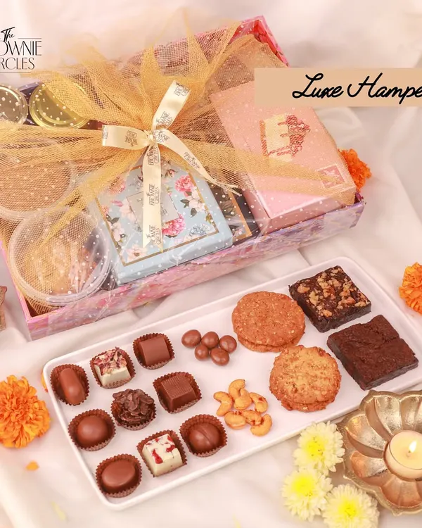 This is what a truly memorable gift looks like. Our Luxe Hamper is thoughtfully curated with an assortment of our finest handcrafted treats, all presented in premium packaging to create a special unboxing experience for your team or clients.