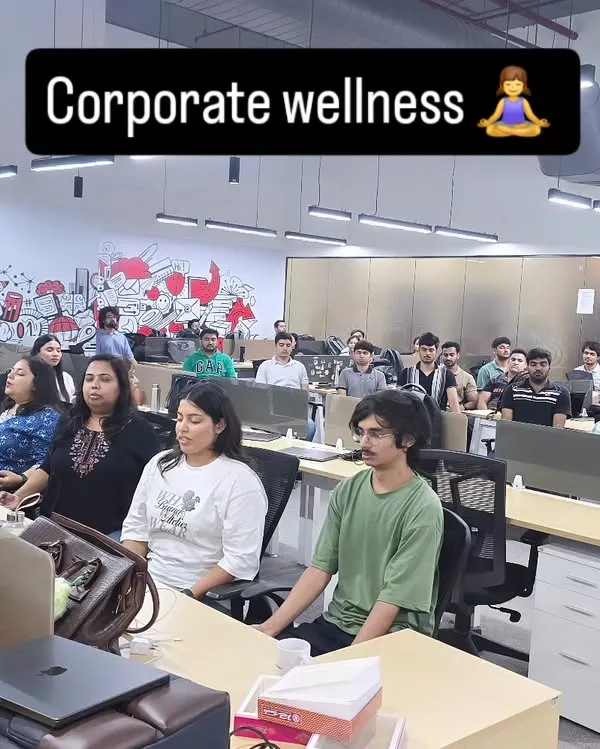 A moment of shared calm during a corporate wellness session. We practice mindfulness to help clear the mind and reset for a more productive afternoon.