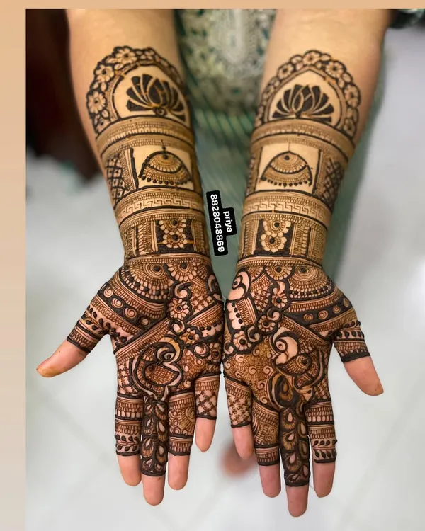 This design features royal palace domes and graceful peacocks, giving it a majestic feel. The combination of bold figures and delicate fill-work is perfect for a bride who wants a traditional yet standout design.