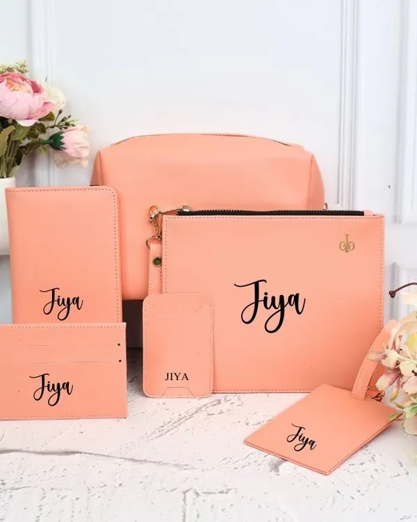 Our complete personalized travel set in a lovely peach color. This 6-piece combo includes a passport cover, luggage tag, card holder, phone card holder, utility pouch, and a larger pouch.