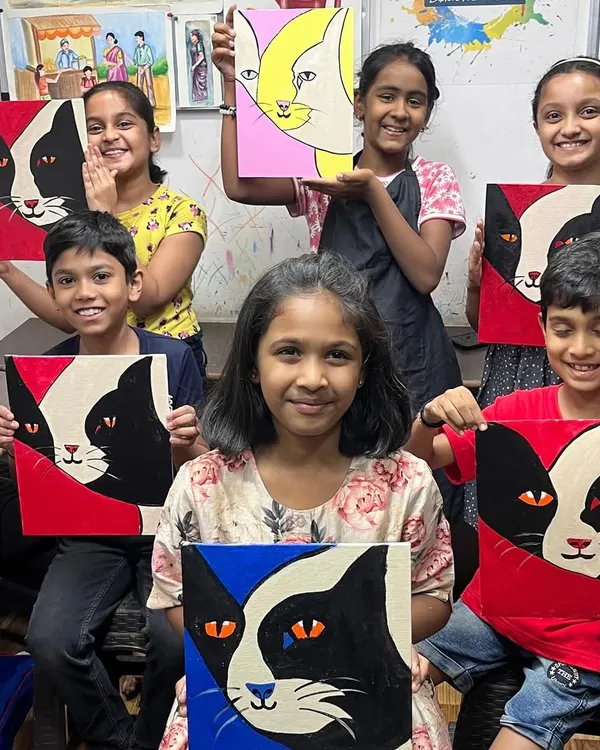 A group of our talented young students showing off their finished cat canvas paintings. It's wonderful to see how each child used the same instructions to create a unique piece of art.