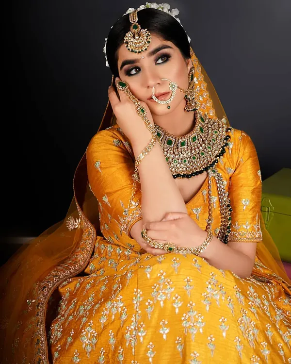 A stunning bridal look created by our team. The makeup is flawless, with beautifully defined eyes and a perfect base, complemented by elegant jewelry and hairstyling.