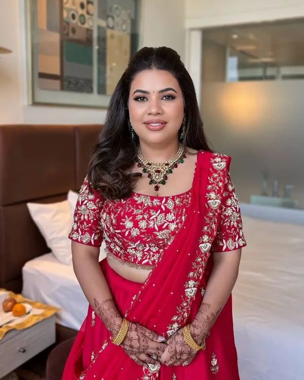 Pallavi looking absolutely stunning in red. A classic look with soft, defined eyes and a matching lip.