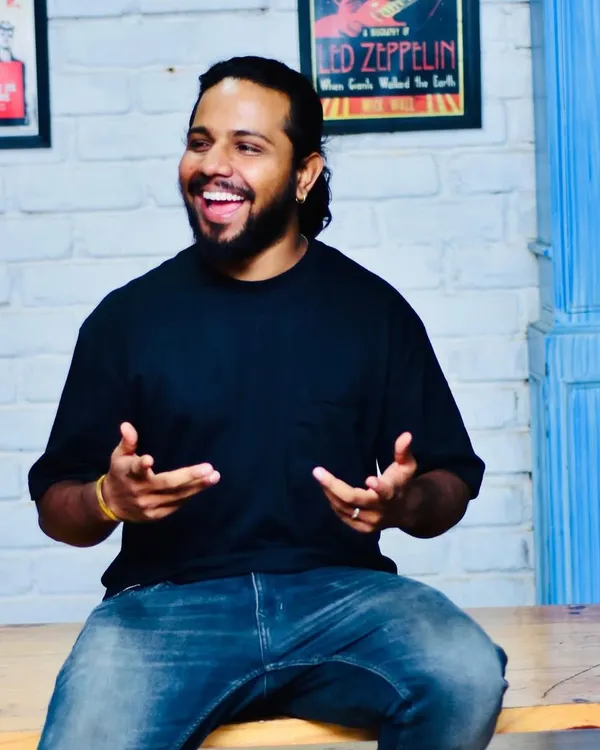 A candid moment of me enjoying the vibe at an event. I believe in being part of the energy, not just creating it.