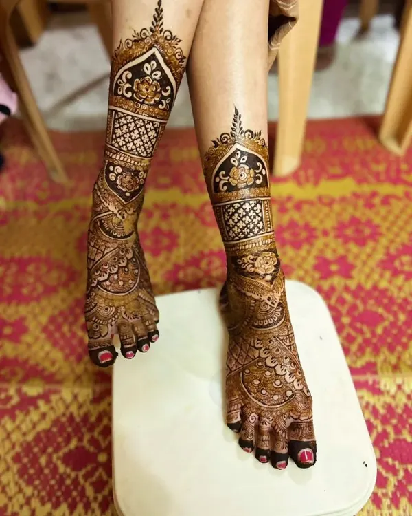 Don't forget the feet! I design stunning bridal foot mehndi that complements your hand designs. This full-coverage leg design features traditional motifs perfect for a bride.