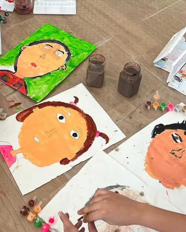 A collection of self-portraits in progress. This activity is a powerful tool for self-expression, helping children observe their own unique features and celebrate their identity.