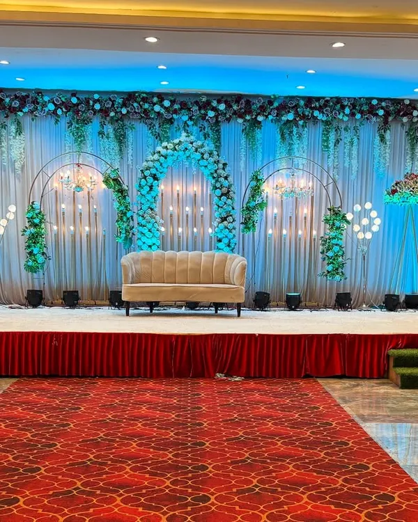 A beautiful and modern stage decoration at Sky banquet hall in Kharghar. The combination of green and white florals with elegant lighting creates a fresh and sophisticated look.