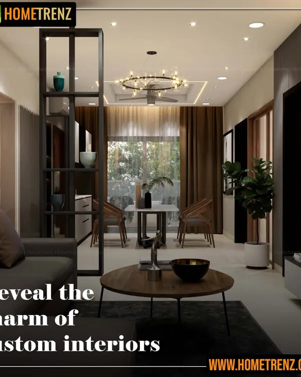 I design custom interiors that are a true reflection of you. This living area features a dark metal partition for subtle separation, a comfortable sofa, and a modern chandelier, all coming together to create a charming and personalized space.