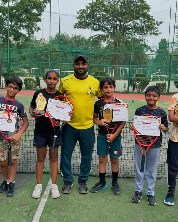 A proud moment with our young achievers from the DDA Tennis Tournament 2024. This group photo showcases the breadth of talent at our academy, with multiple players winning certificates, medals, and trophies.