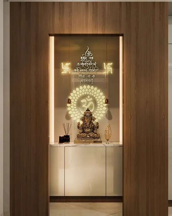 This modern mandir is designed as a niche within a wooden-paneled wall. It features a backlit "Om" symbol and sacred mantras, creating a divine glow.