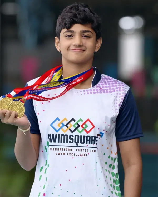 We believe in turning dedication into victory. This is one of our star athletes, Nishada Mithra, showcasing her impressive medal haul from the Tamil Nadu State Meet, a testament to our competitive swimming program's success.