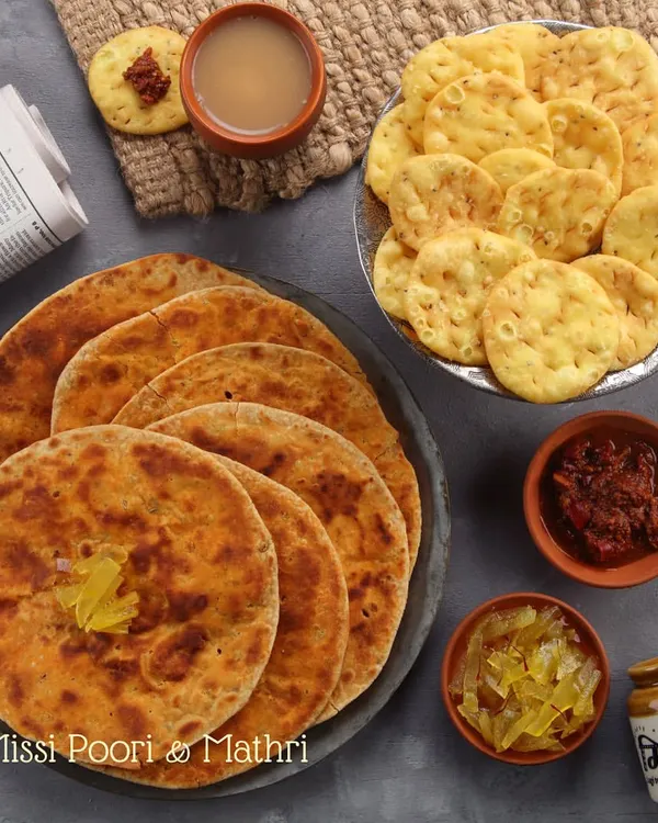 This is our idea of a perfect Sunday afternoon. A plate of warm, ghee-topped Missi Poori and a side of flaky Mathri, enjoyed with hot chai and a selection of our homemade pickles. It’s comfort food at its finest.