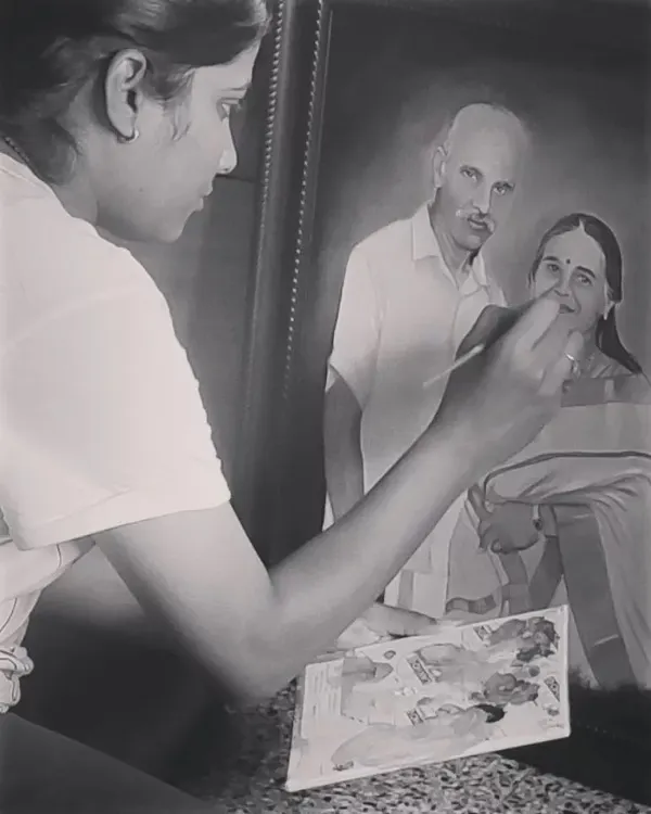 Here I am in my studio, adding the final touches to a commissioned oil portrait. Working with oils allows me to build rich layers and create a truly lifelike and enduring piece of art.