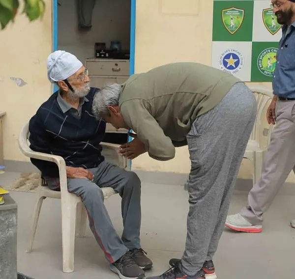 The ultimate mark of respect. Legendary cricketer Ajay Jadeja seeks blessings from his coach, Shri Gurcharan Singh, during a visit to the academy. This is the culture of 'Guru-Shishya Parampara' we uphold.