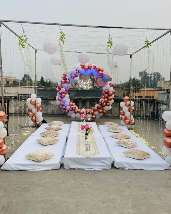 We transformed this terrace into a chic bachelorette party lounge. The setup includes a full canopy with fairy lights and paper lanterns, low seating with comfortable cushions, and a stunning "Bride to be" balloon ring backdrop, creating a perfect atmosphere for day or night celebrations.