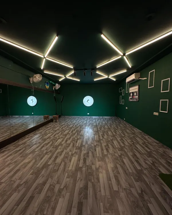 Welcome to Flex Studio. We designed this space as a clean, creative canvas with professional green walls, custom lighting, and a full-length mirror for you to bring your vision to life.