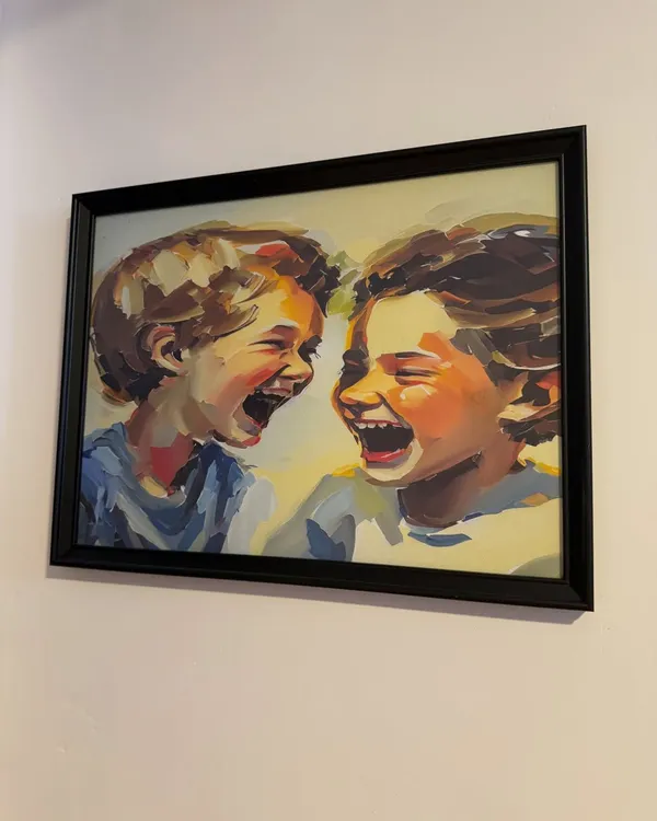 This painting of laughing children on our wall perfectly captures the spirit of our studio. We believe joy and laughter are essential for learning.