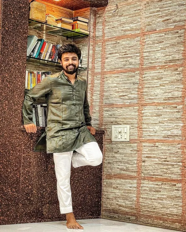 A quiet moment at home. This is me in my element, surrounded by books and wearing traditional Indian attire.