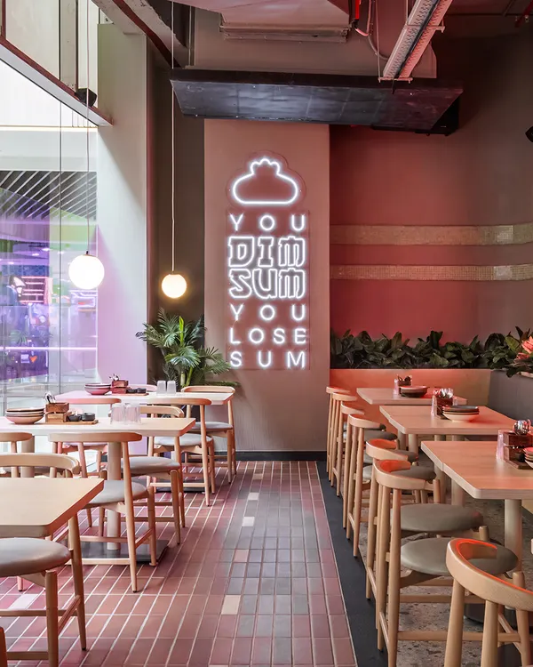 The playful neon sign at Lucky Chan is a perfect example of how we use light to inject personality and brand voice directly into the decor. It's a fun, memorable, and highly photographic moment.