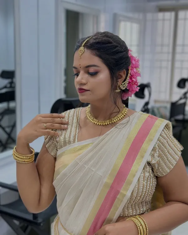 A stunning South Indian bridal makeup look created by one of our students. The focus is on flawless skin, defined eyes, and traditional accessories.