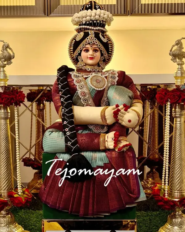 A beautifully decorated doll representing the goddess Lakshmi, ready for a housewarming ceremony. Every corner of a new home should begin with a blessing.