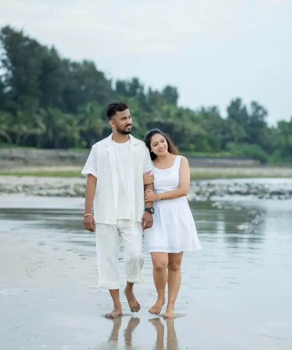 A quiet walk on the beach, just the two of you. I love capturing these simple, serene moments during a pre-wedding shoot.