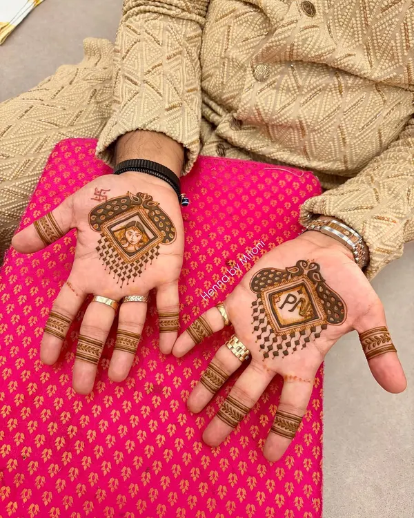 Grooms deserve special mehendi too. This is a custom design for the groom, featuring his and his partner's initials along with a fun portrait, making it a memorable part of the wedding festivities.