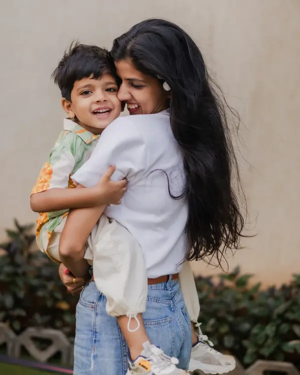 A warm hug and a genuine smile. During our outdoor family sessions, I look for these natural moments of affection that truly show the bond between a parent and child.