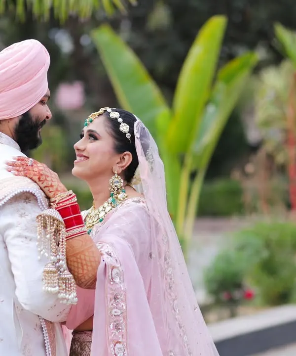 A beautiful candid moment between a Sikh bride and groom. The way she looks at him and his gentle smile create a portrait filled with love and warmth.