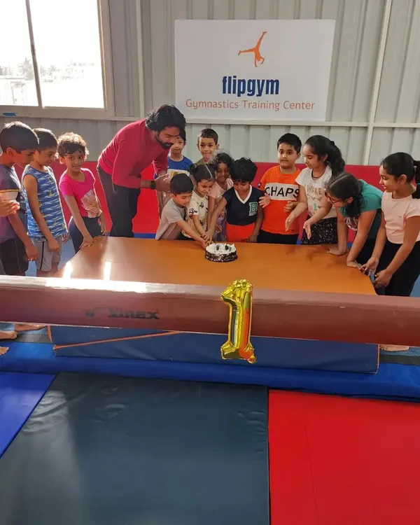 We love celebrating milestones together. Here is the whole crew gathered to cut the cake for Flipgym's first anniversary.