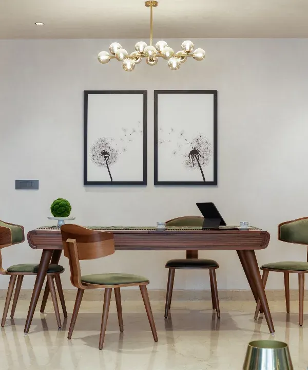 The dining space at Rue 32 is a symphony of wooden textures against an olive green backdrop. The detail-driven, custom-made dining table and chairs create an atmosphere of contemporary elegance, setting the stage for shared moments and connection.