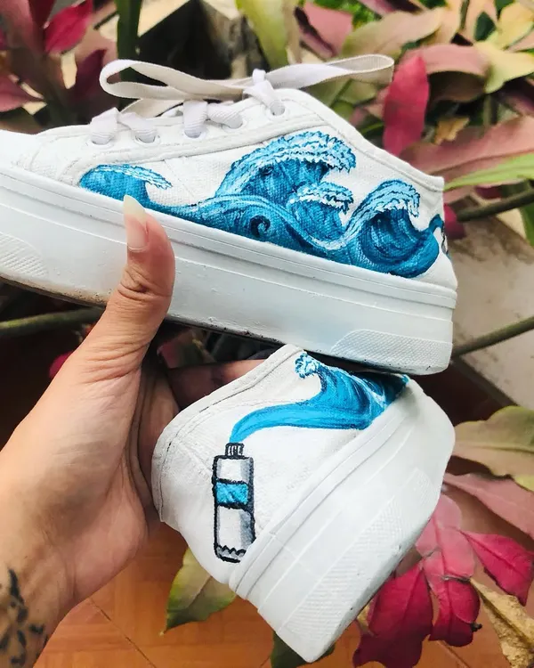 A closer look at the hand-painted shoes, turning old footwear into a piece of wearable ocean art. If you have an old pair of shoes you love, we can work together to give them a creative new beginning.
