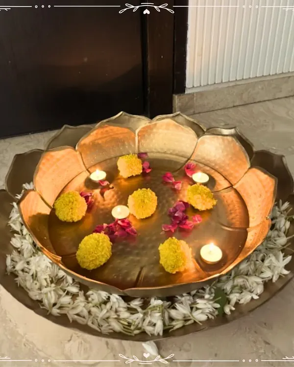 I love creating pieces that bring tranquility and beauty to your home. This large, handcrafted metal urli, styled with floating marigolds and tea lights, creates a serene and welcoming centerpiece, perfect for any festive occasion or to simply elevate your daily living space.
