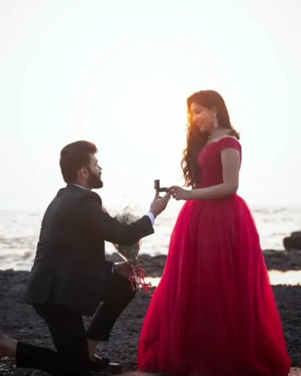 For a classic beach photoshoot, we provided this sharp black suit for the groom to be, which pairs perfectly with our red gown.