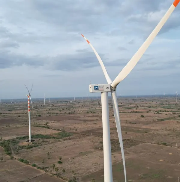 An aerial view of our first commissioned wind turbine at Project Shiva, our 180 MW wind-solar hybrid facility in Thoothukudi, Tamil Nadu. This project marks a significant milestone in our journey to provide integrated and reliable clean energy solutions.