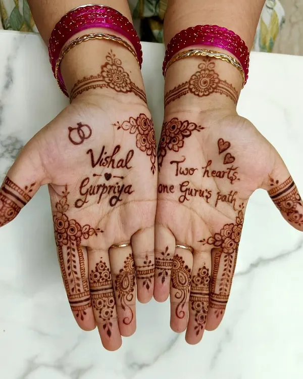 A personalized engagement mehendi for Gurpriya, featuring the couple's names, "Vishal & Gurpriya," and interlocking rings.