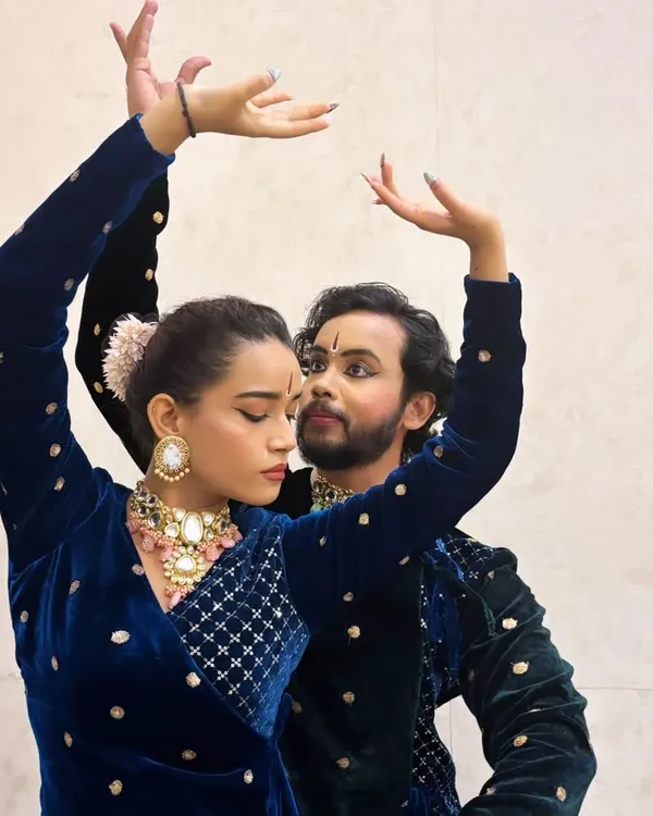 A close up shot with my co-dancer, capturing the intricate hand gestures (mudras) and expressions central to Kathak storytelling. We are wearing coordinated blue velvet costumes for this performance.