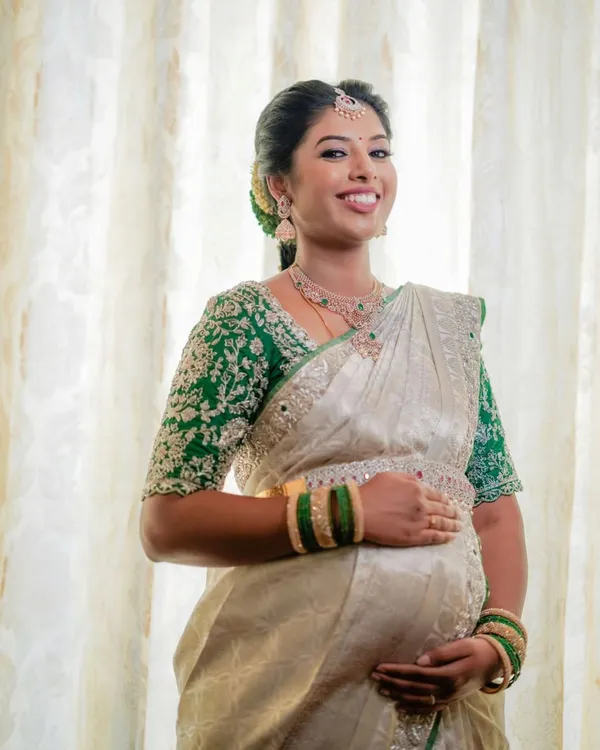 The beautiful Swathi glowing at her baby shower. I created a fresh, traditional look with a focus on radiant skin to celebrate this special milestone.