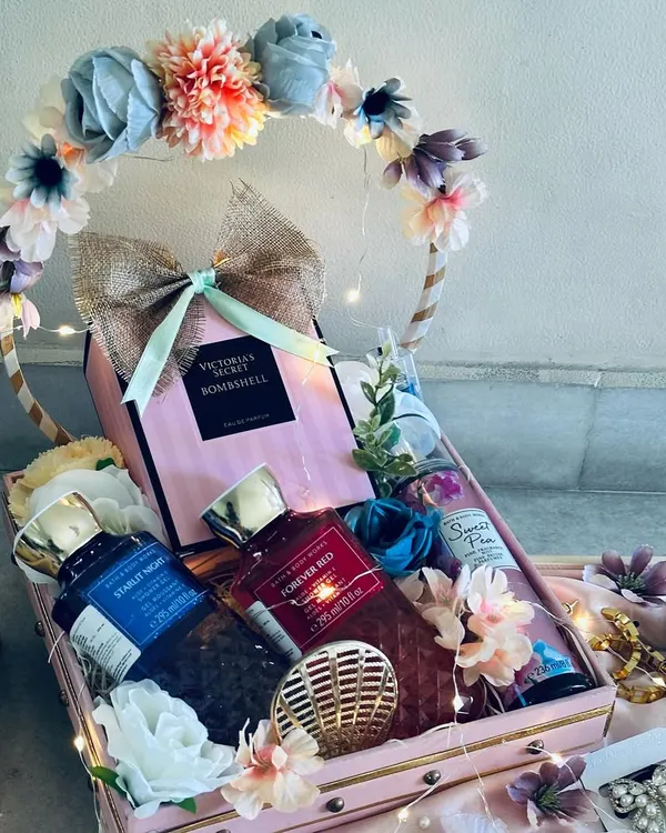 We believe a gift should be an experience. This dreamy wedding trousseau, set in a bespoke floral hoop trunk with delicate fairy lights, is curated with luxury perfumes and accessories to celebrate a beautiful new beginning.