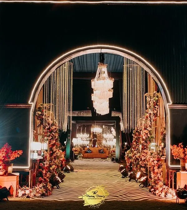 The entrance to your Sangeet sets the tone for the entire night. I designed this illuminated archway to create a sense of drama and excitement, guiding guests into a world of glamour and celebration.