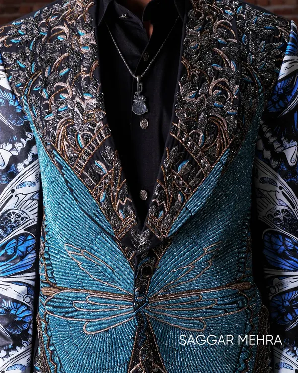 A close-up of the handcrafted butterfly jacket, showcasing thousands of beads meticulously embroidered to create a symmetrical, textural masterpiece. This piece embodies my philosophy of turning symbolism into wearable art, where every stitch is a statement of couture craftsmanship.