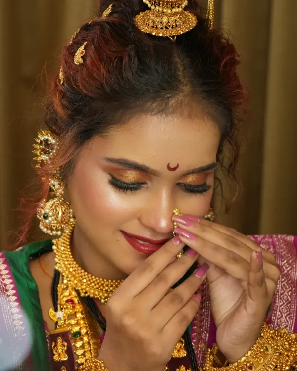 A close-up of the Peshwai bridal look, focusing on the expressive eye makeup and the placement of the traditional nath. These are the details that bring the entire look to life.